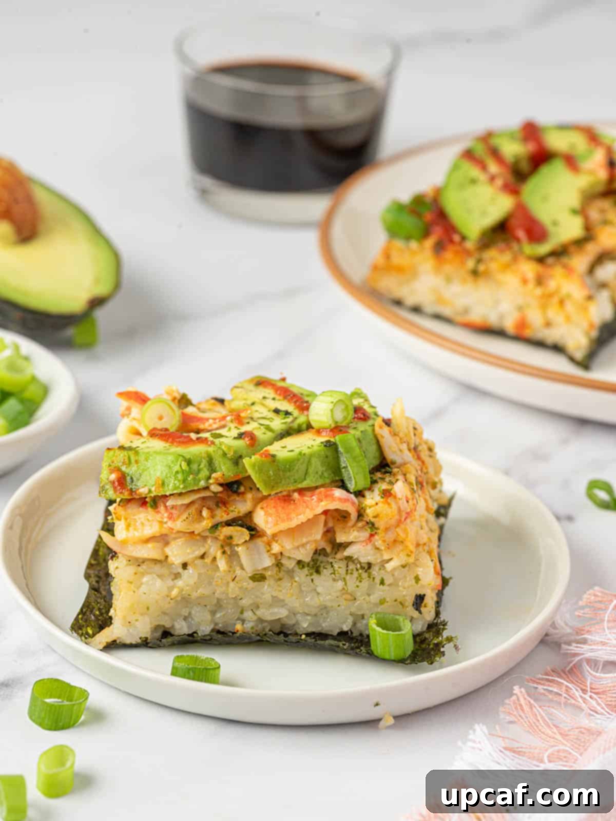 Deconstructed sushi roll on a plate, ready to be enjoyed.