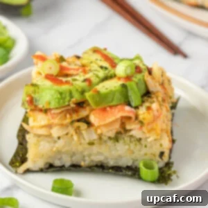 A piece of sushi bake on nori on a plate.