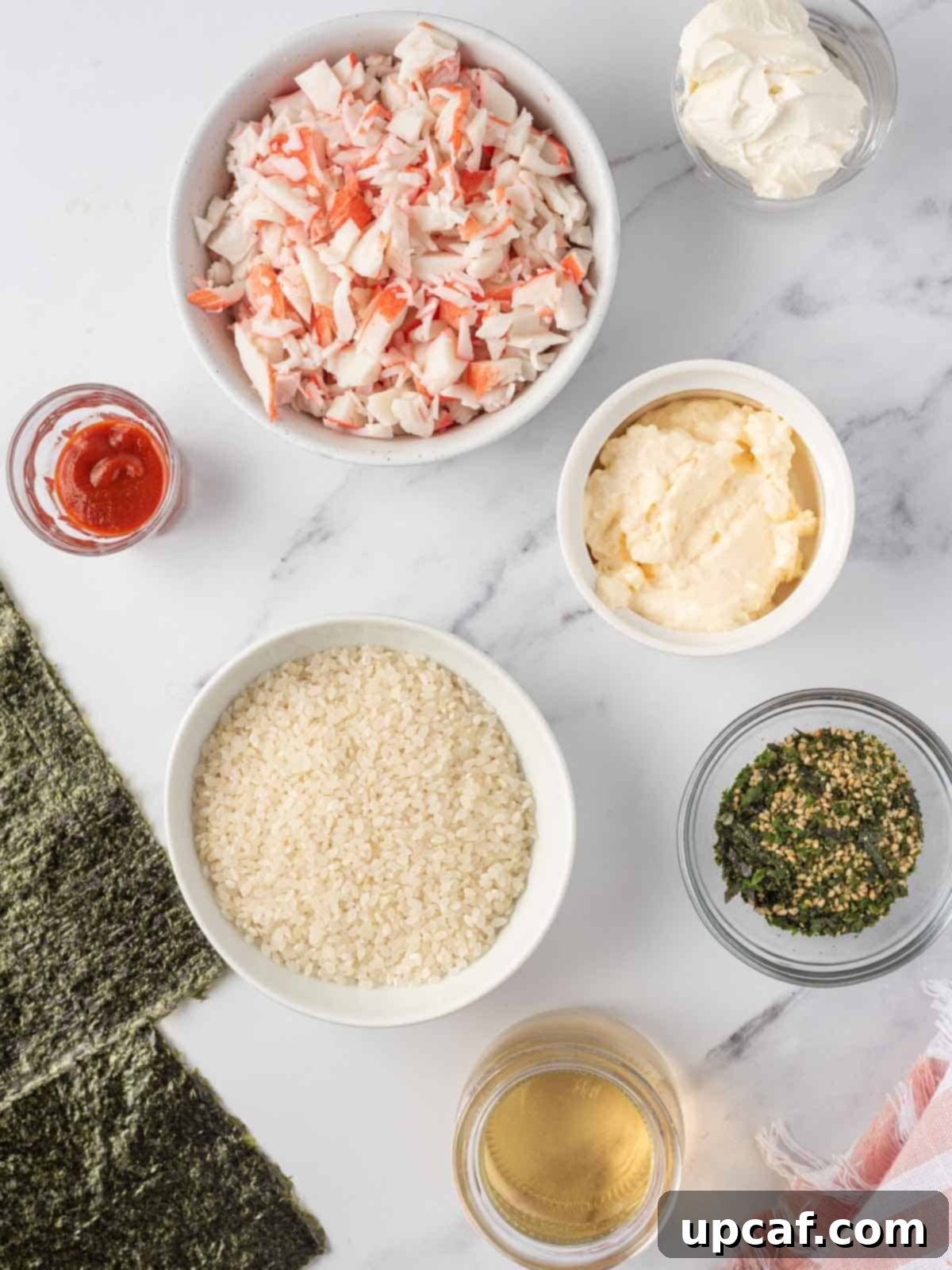 Various fresh ingredients for easy sushi bake laid out on a table.