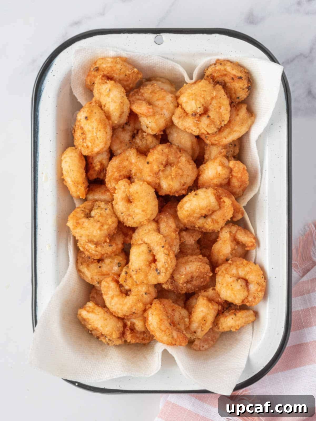 Blazing Burst Shrimp 5 A platter full of perfectly golden and crispy fried shrimp, ready for sauce.