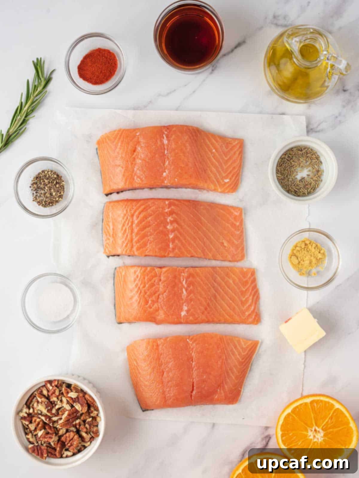 Caramelized Maple Pecan Salmon 3 A selection of ingredients laid out for making maple pecan glazed salmon.