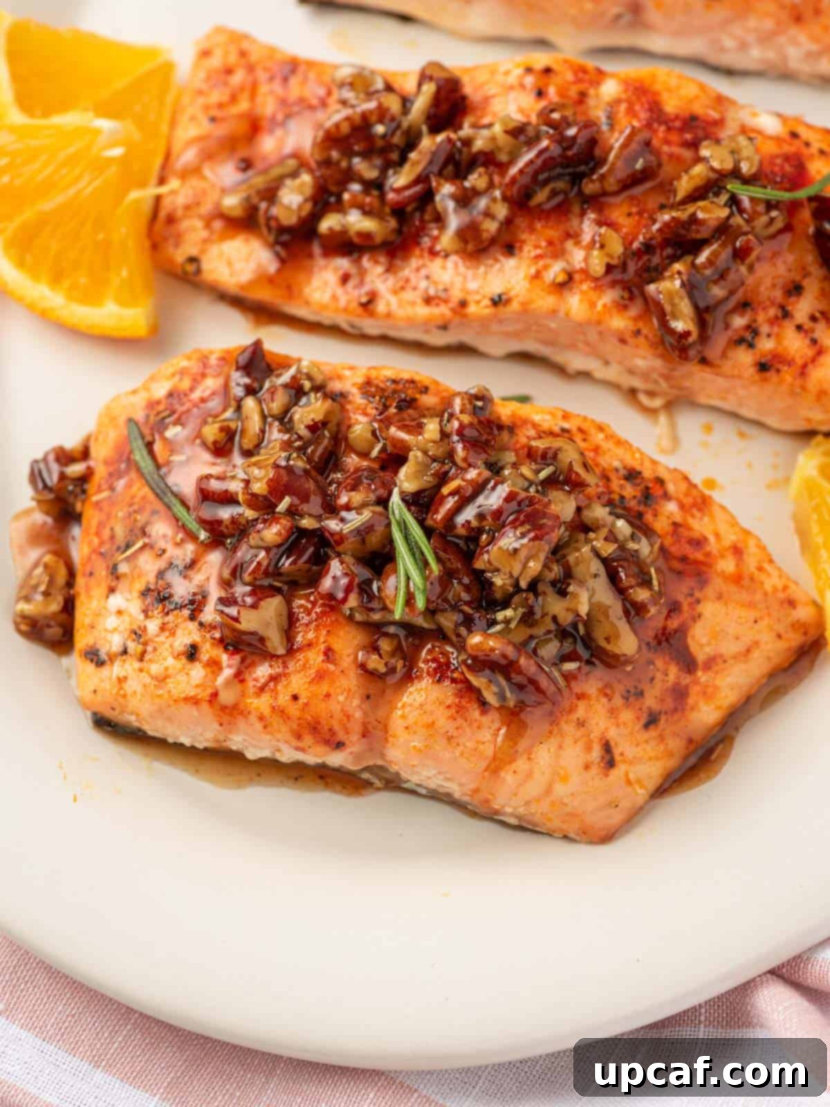 Caramelized Maple Pecan Salmon 6 A large platter showcasing perfectly cooked salmon with maple syrup and pecans.