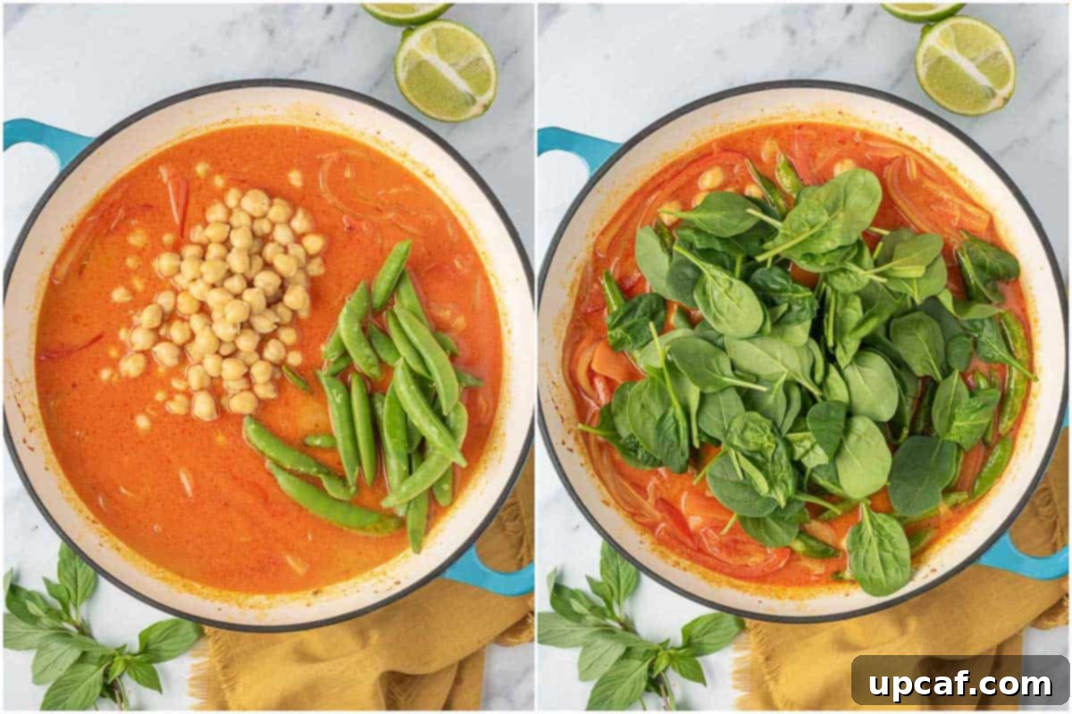 Vibrant Red Thai Plant-Based Curry 5 Canned coconut milk and salt being poured into the skillet with sautéed aromatics, red bell pepper, and carrots, forming the luscious base of the red curry sauce, with chickpeas, snow peas, and spinach nearby ready to be incorporated.