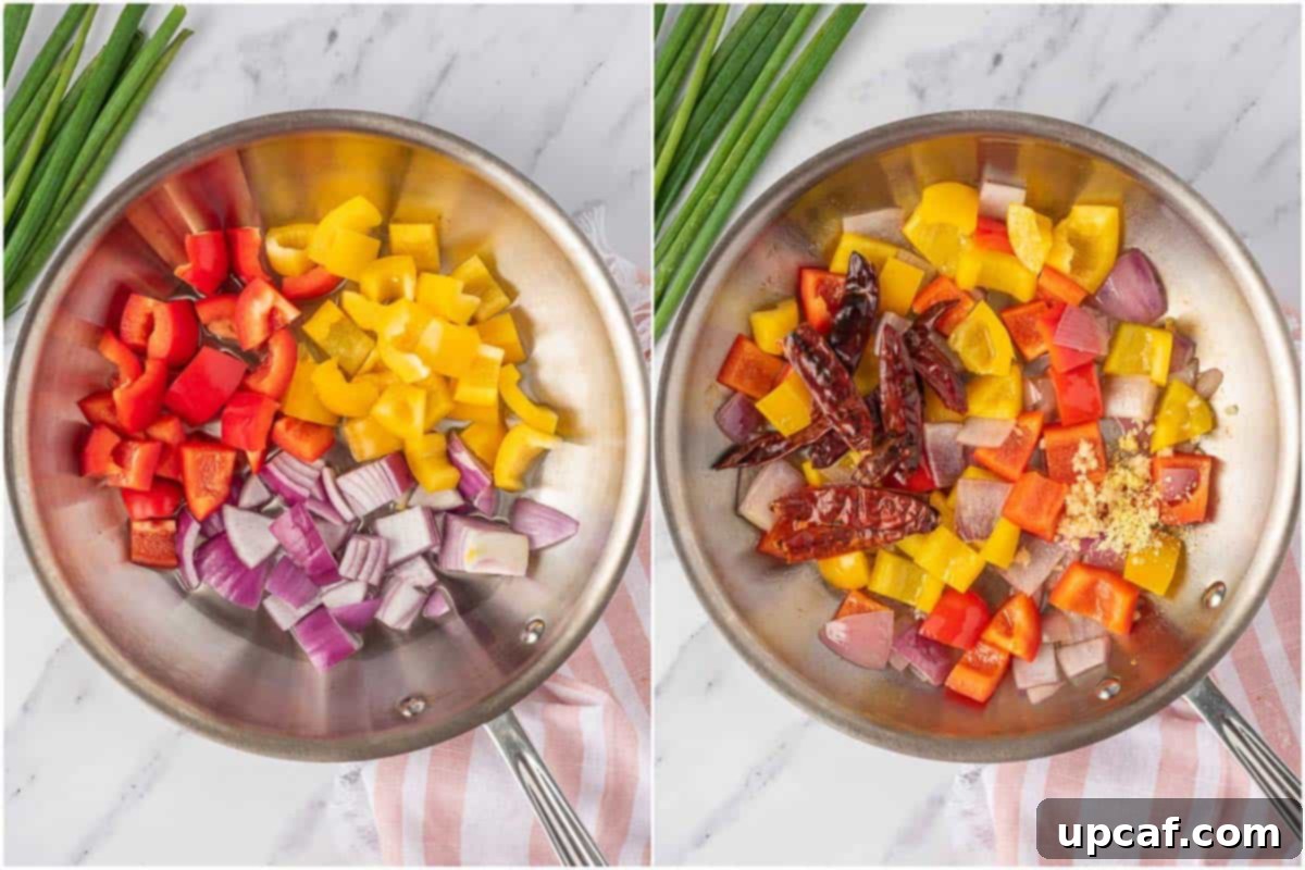 Freshly cut onions and bell peppers being stir-fried in a hot skillet, showing the beginning of the Kung Pao Shrimp cooking process.