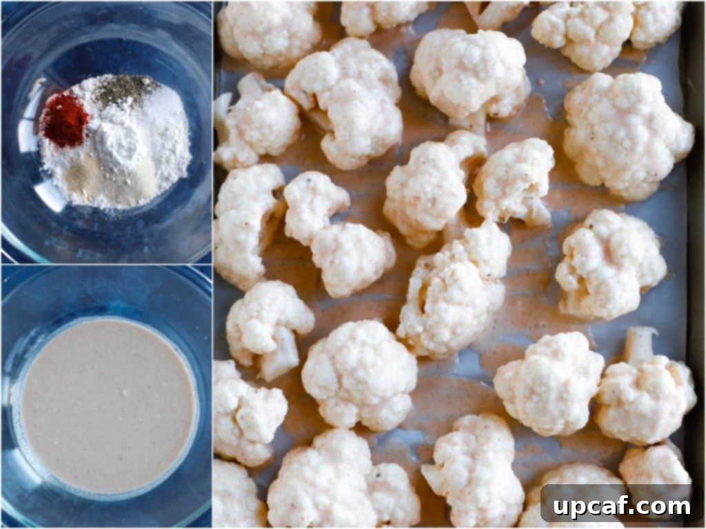 Cauliflower florets being coated in a seasoned batter in a mixing bowl, showcasing the initial step of the recipe.