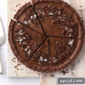 Decadent Vegan Chocolate Dream 12 Sliced of vegan chocolate pie on a board.