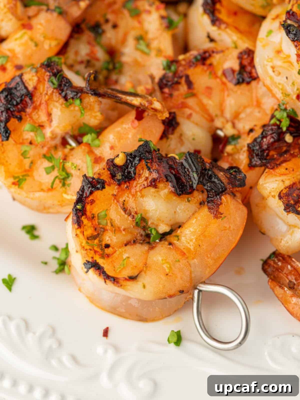 Zesty Garlic Shrimp Skewers 7 Closeup of zesty grilled garlic shrimp skewers.