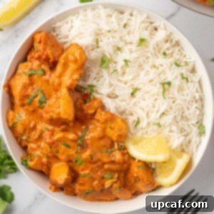 A bowl of indian tikka masala with chicken.
