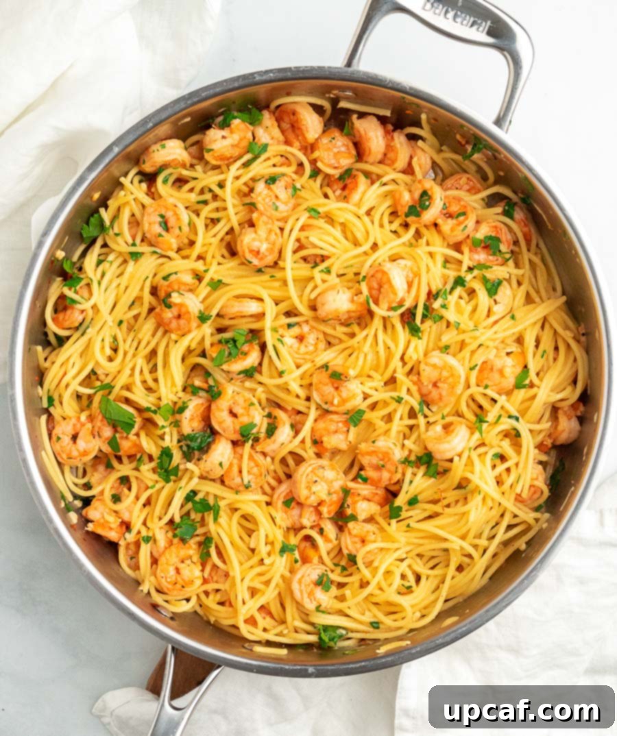 A close-up shot of the creamy Garlic Parmesan Shrimp Spaghetti in a pan, showcasing the rich sauce and tender shrimp.