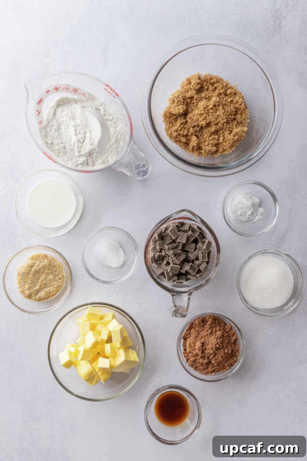 A curated collection of ingredients neatly arranged on a counter, ready for baking delicious vegan double chocolate cookies.