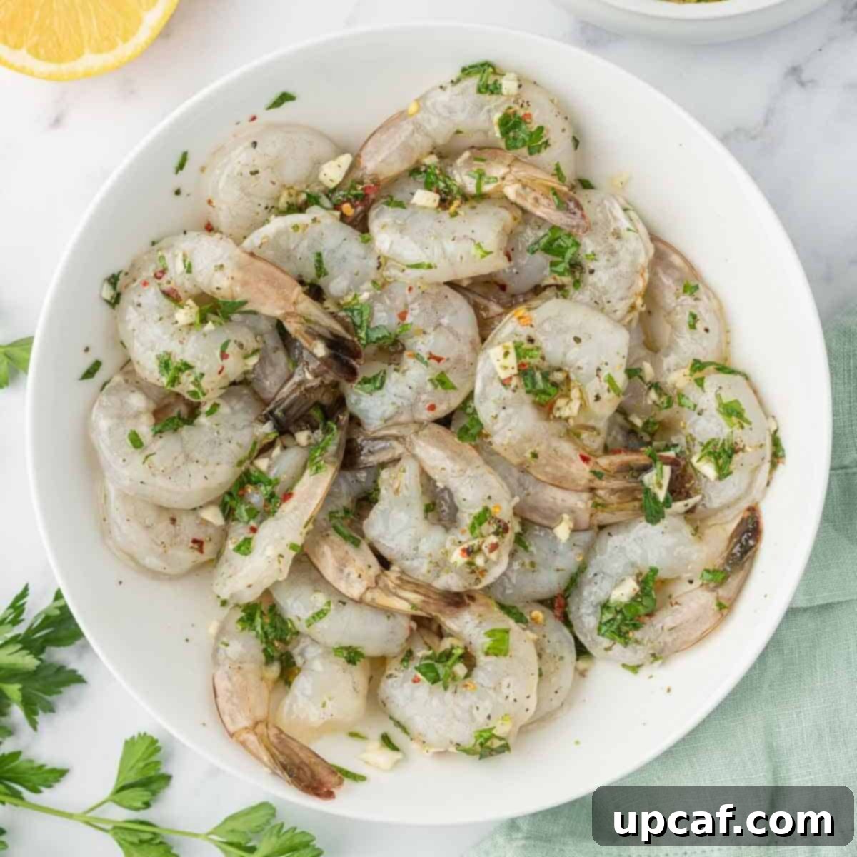 Flame-Kissed Garlic Prawns 5 How to marinate shrimp for grilled garlic shrimp skewers, showing shrimp coated in marinade.