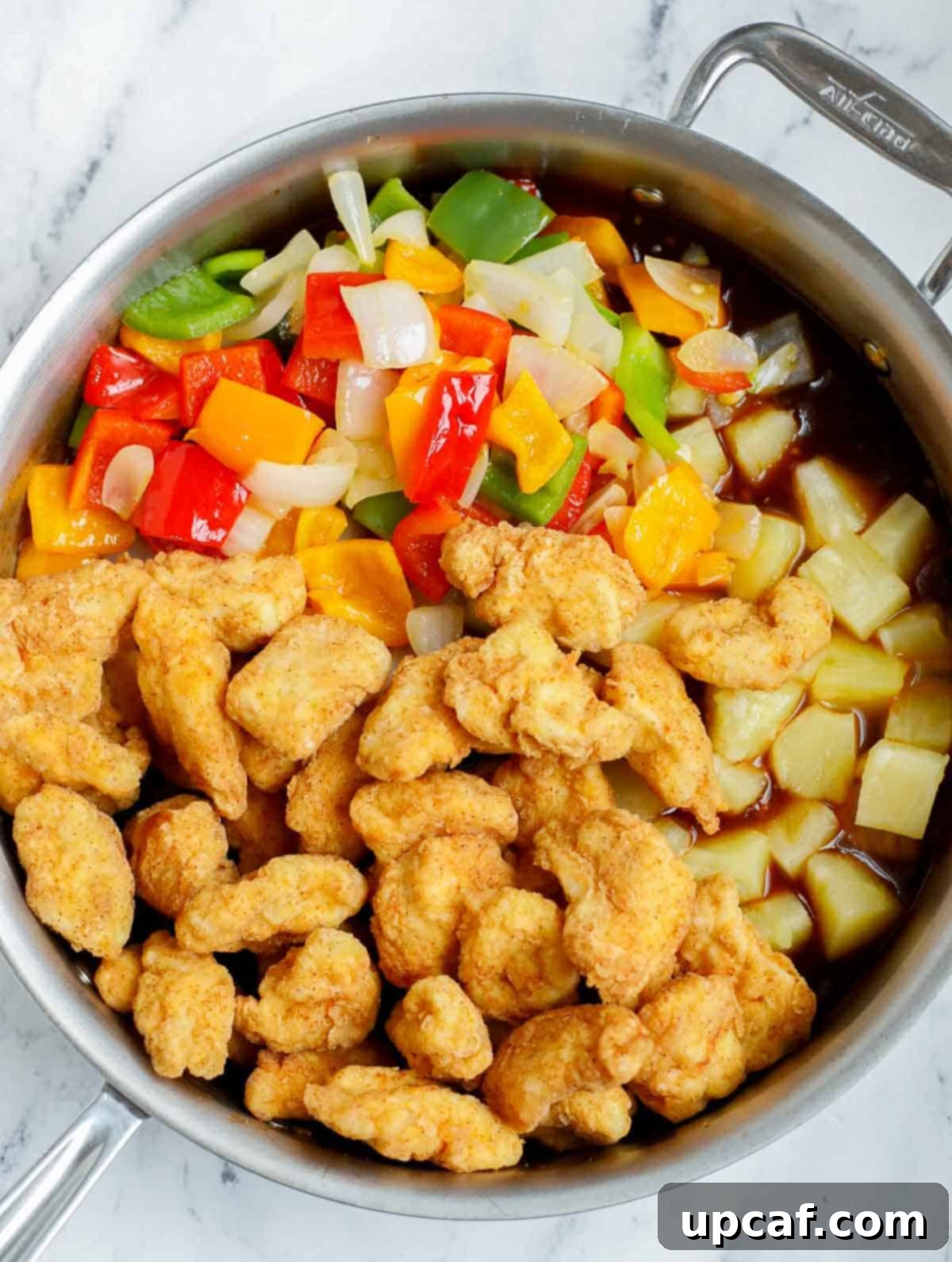Crafting Delicious Sweet and Sour Chicken at Home 11 Combining ingredients for Chinese sweet and sour chicken recipe.