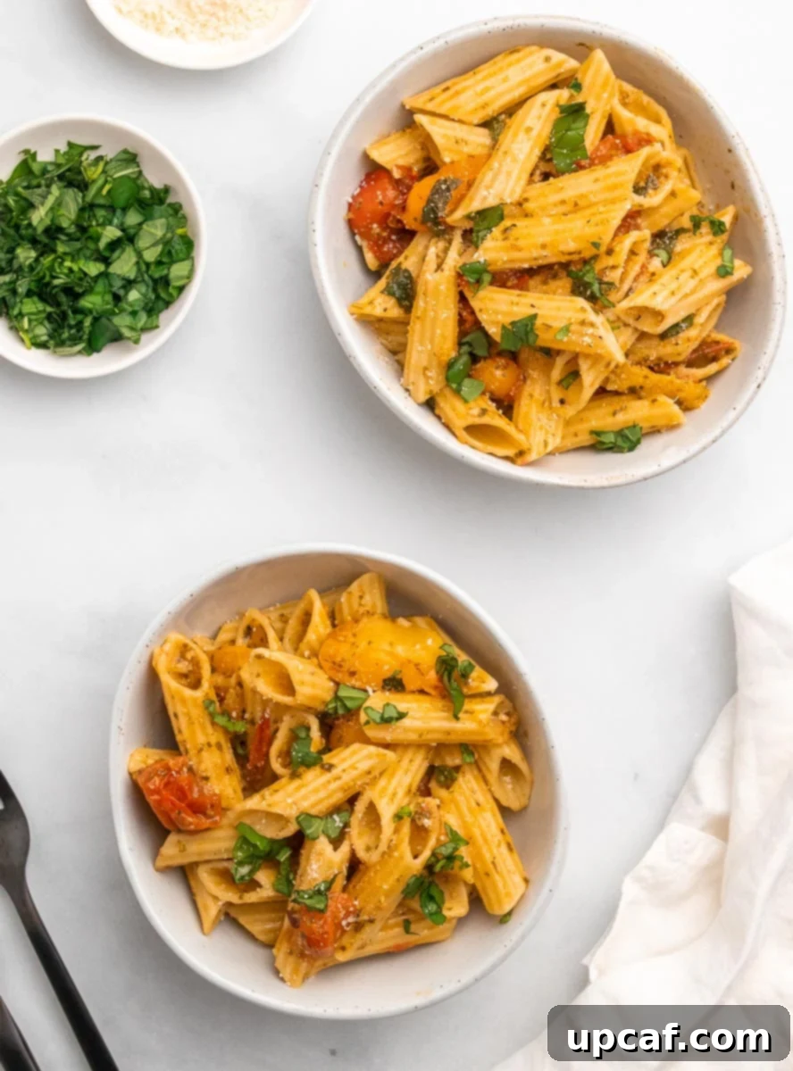 Bursting Cherry Tomato Pesto Pasta 2 top down view of two bowls of cherry tomato pesto pasta