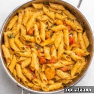 Bursting Cherry Tomato Pesto Pasta 11 cherry tomato pesto pasta in a skillet