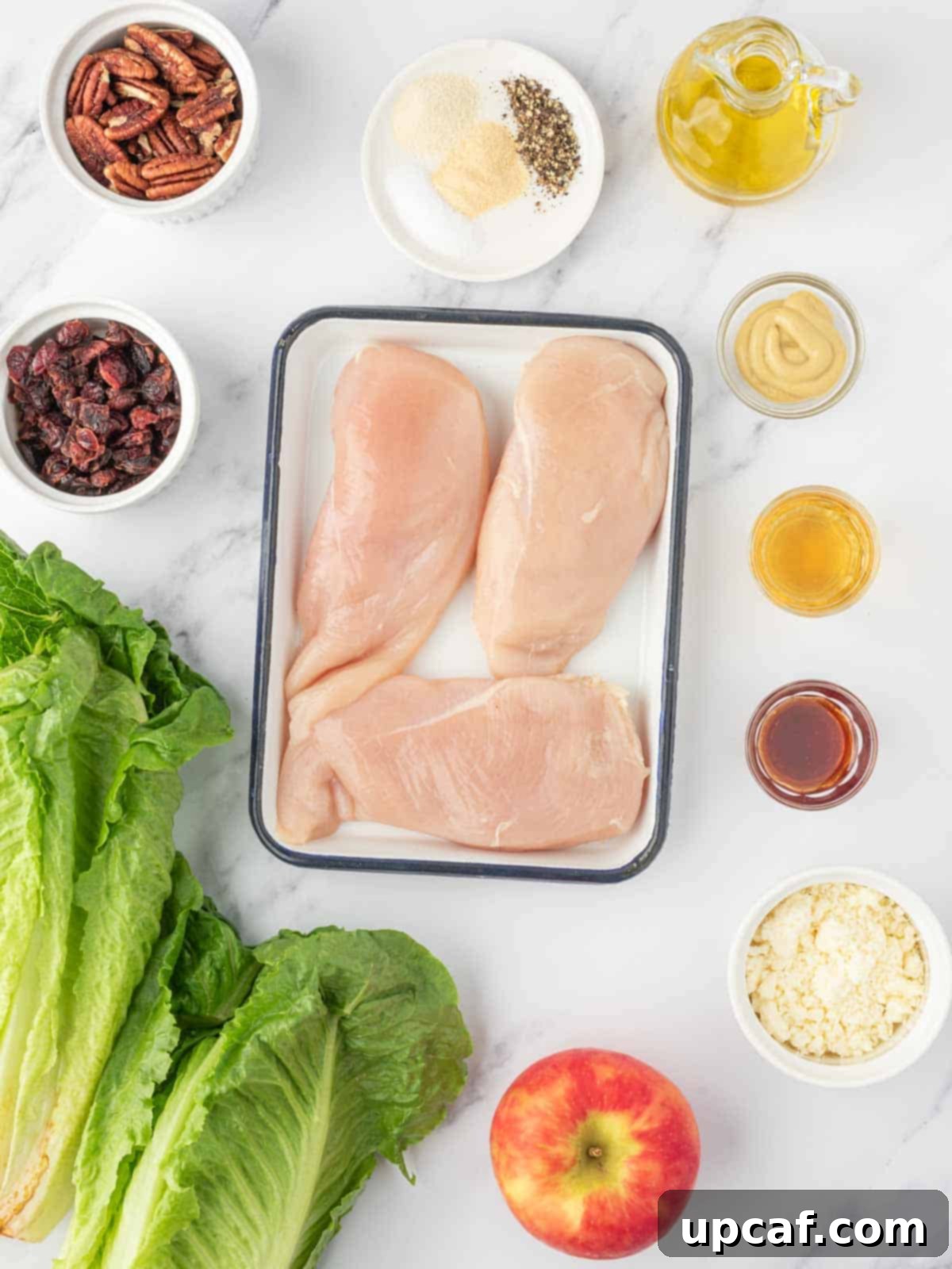 Fall Harvest Chopped Chicken Salad 3 All the fresh ingredients laid out on a table, ready to be prepared for the healthy autumn chicken salad.