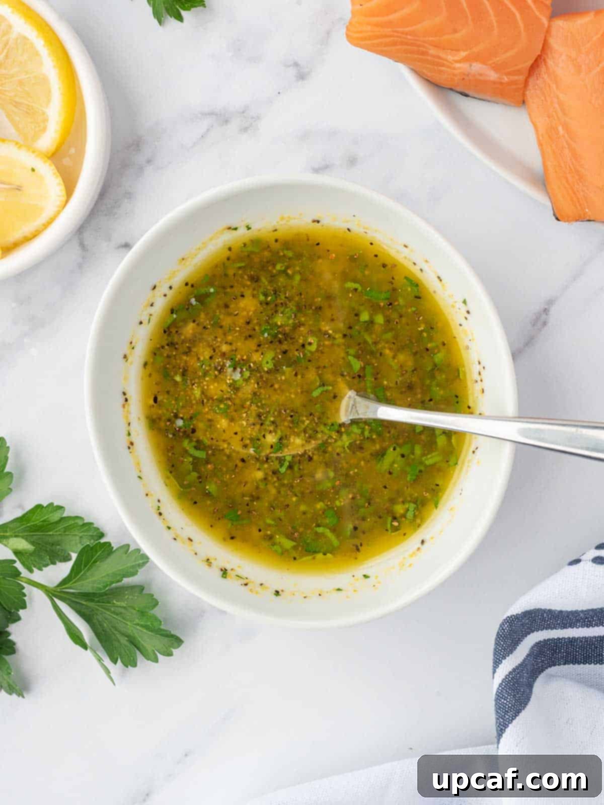 Zesty Lemon Pepper Salmon 4 Lemon pepper marinade mixture in a small bowl.