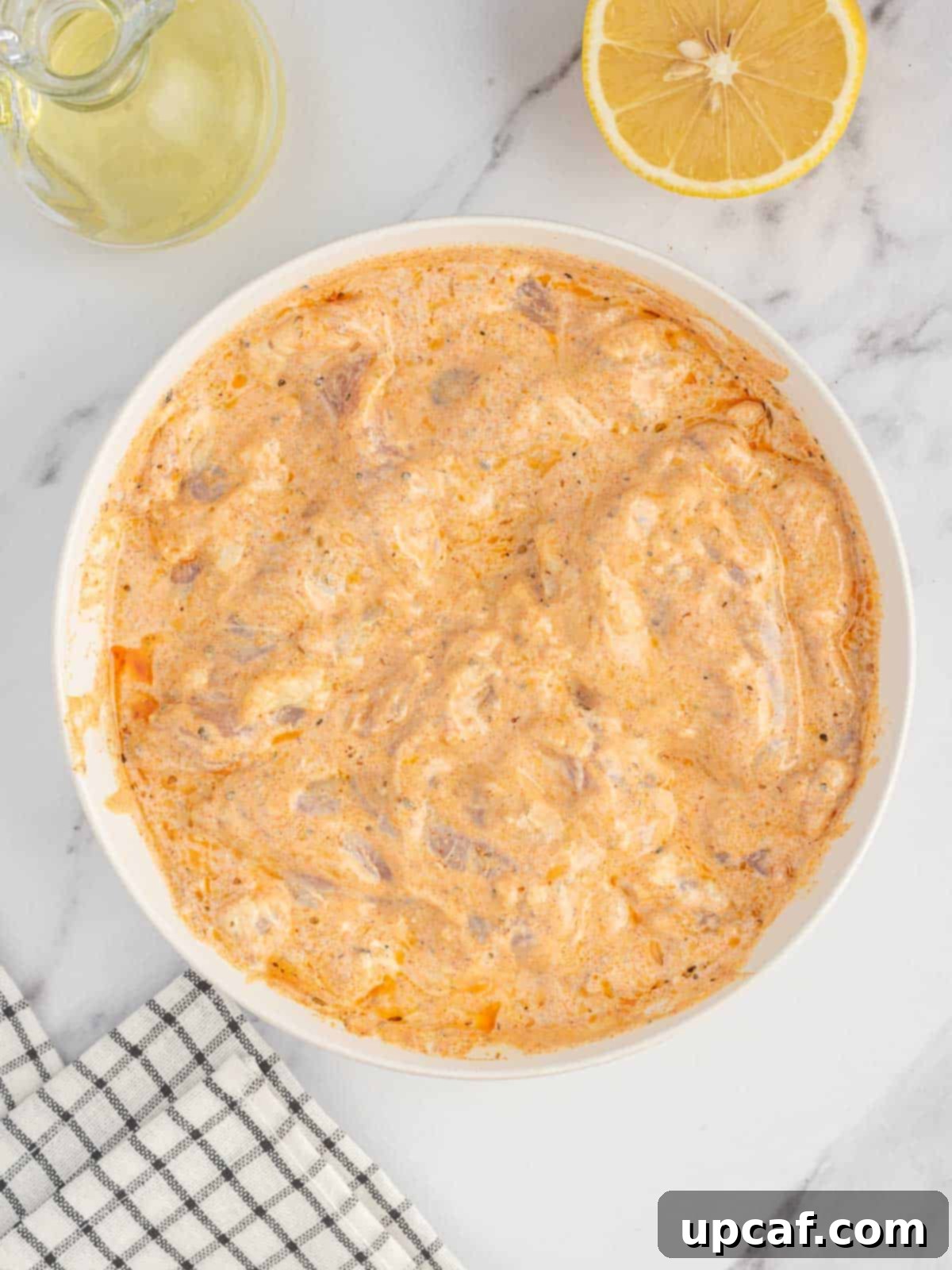 How to marinate chicken for authentic chicken gyros with yogurt, lemon, and spices.