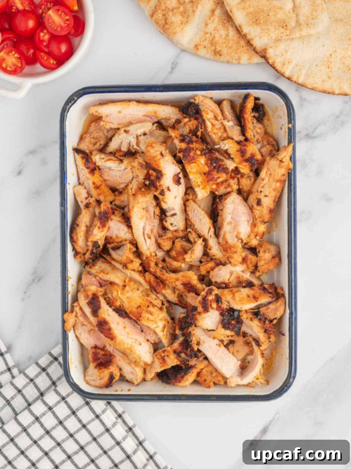 Marinated and grilled chicken for homemade Greek chicken gyros, perfectly seared.