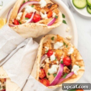 Homemade Greek chicken gyros on a plate.