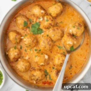 Thai Spiced Chicken Meatballs 11 Meatballs in a skillet with coconut curry sauce.