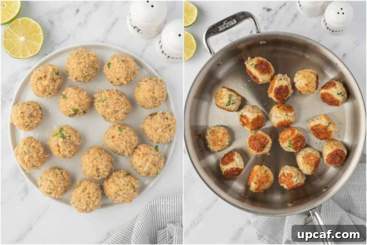 Thai Spiced Chicken Meatballs 5 Close-up of golden-brown Thai chicken meatballs being browned to perfection in a hot skillet, ready for their creamy curry bath.