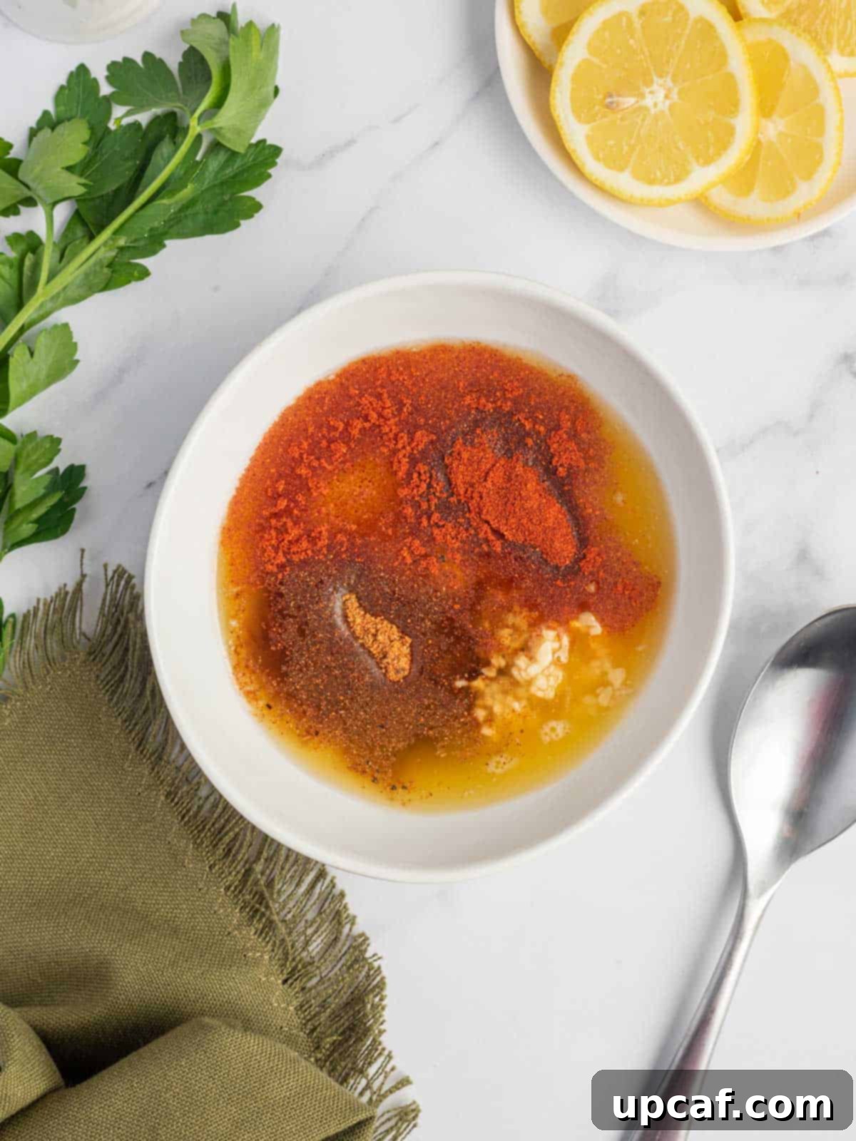 Cajun Garlic Butter Baked Cod 4 A bowl of cajun garlic butter sauce.