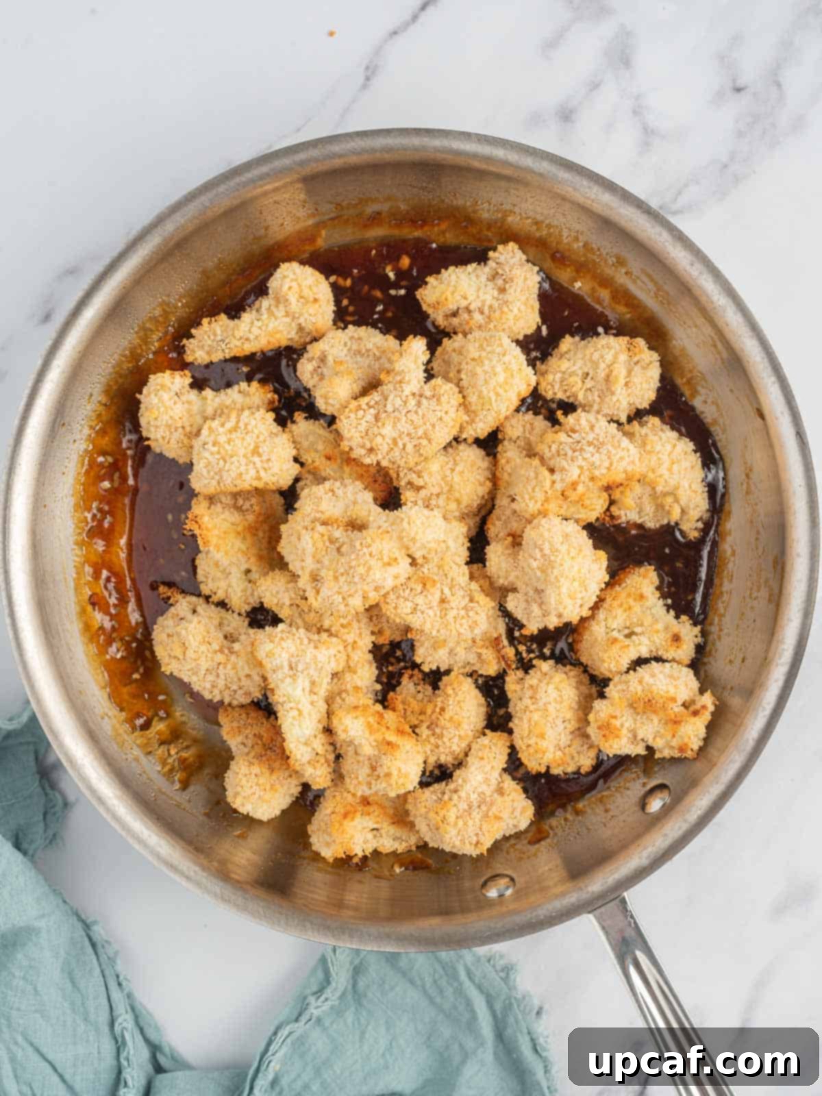Sesame Glazed Cauliflower Poppers 7 Baked cauliflower bites are tossed with asian sesame sauce.