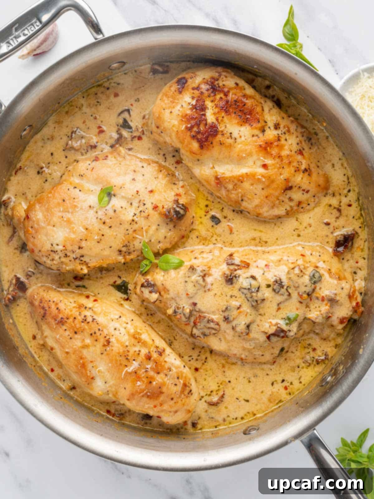 Effortless Marry Me Chicken Perfection 6 Easy Marry Me Chicken recipe, cooked in a skillet, showcasing the golden-brown chicken in rich, creamy sauce with sun-dried tomatoes.