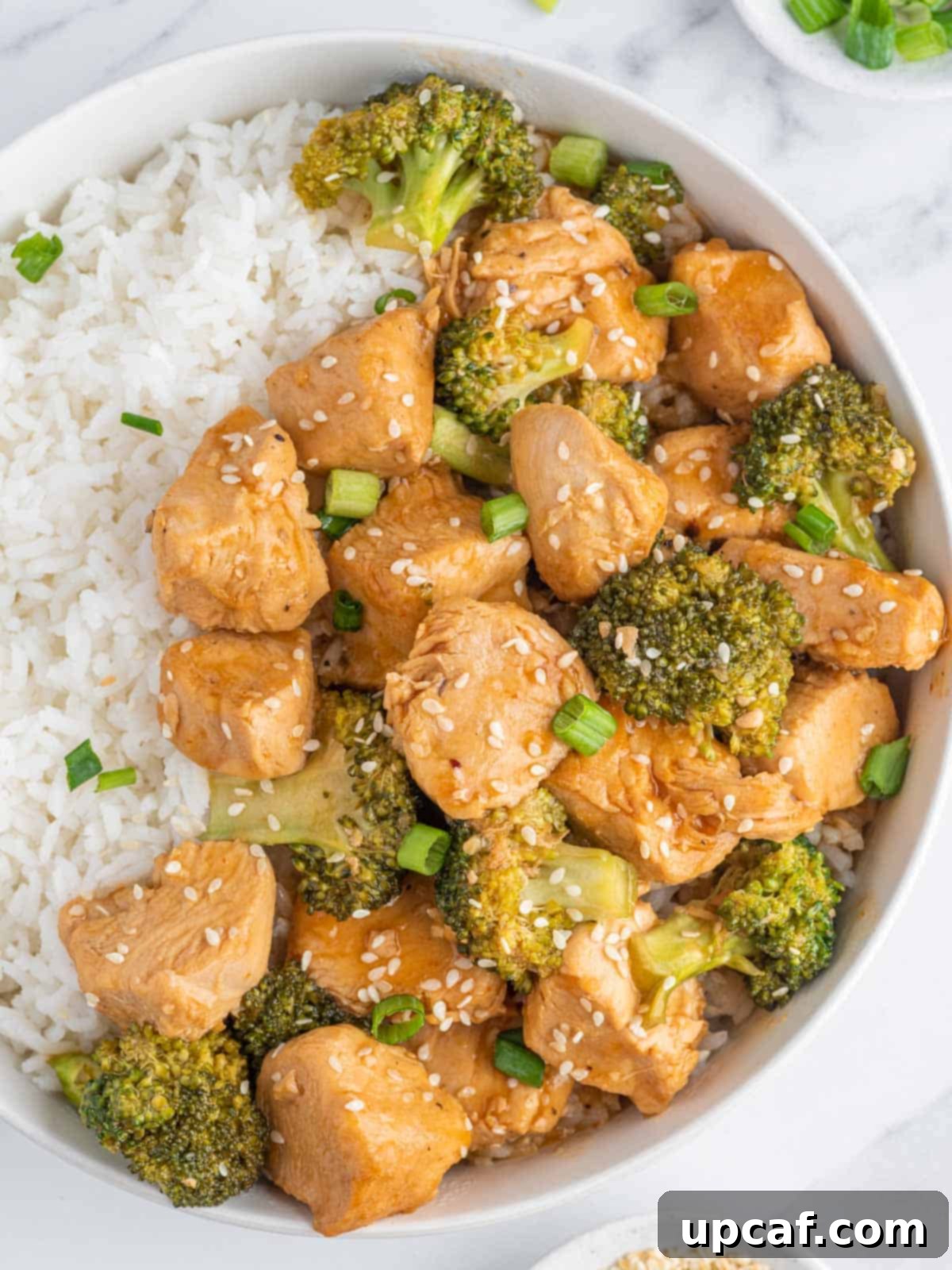 Chicken and broccoli instant pot stir fry on a plate with rice.