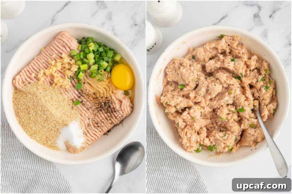 A large bowl showing ground chicken being mixed with other ingredients to form meatballs.