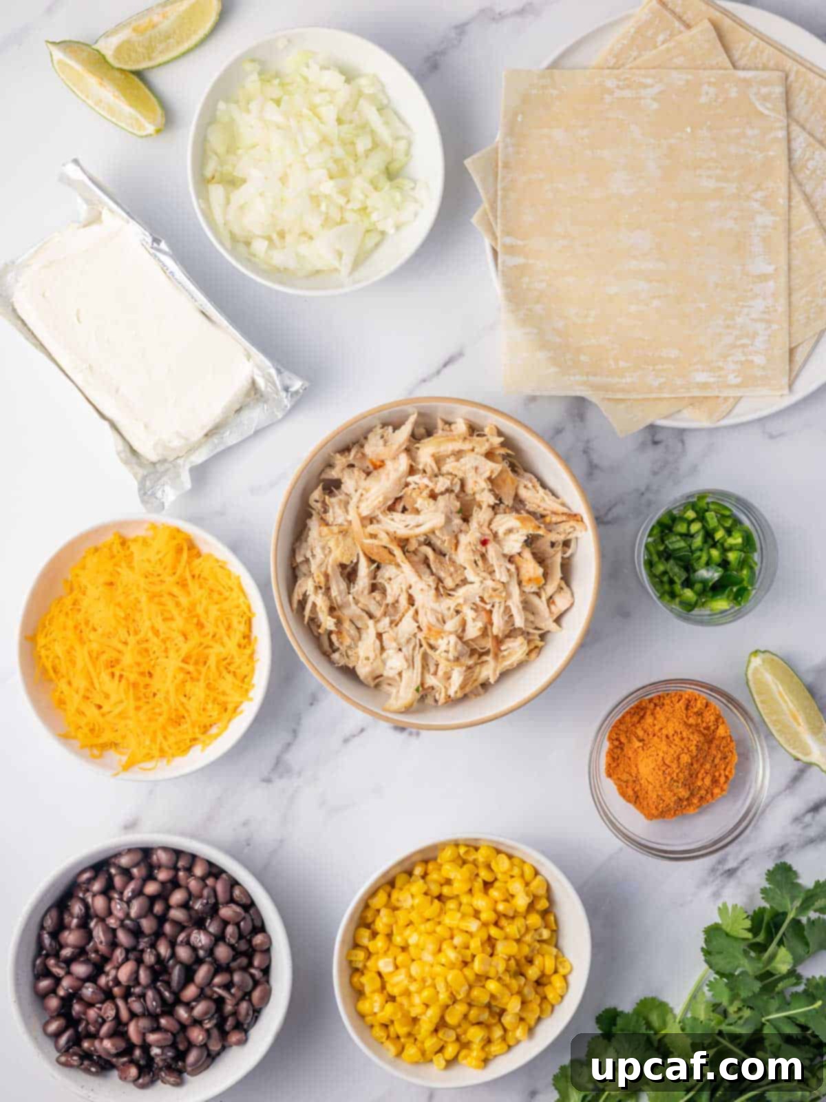 A vibrant array of southwest egg roll ingredients laid out on a table.