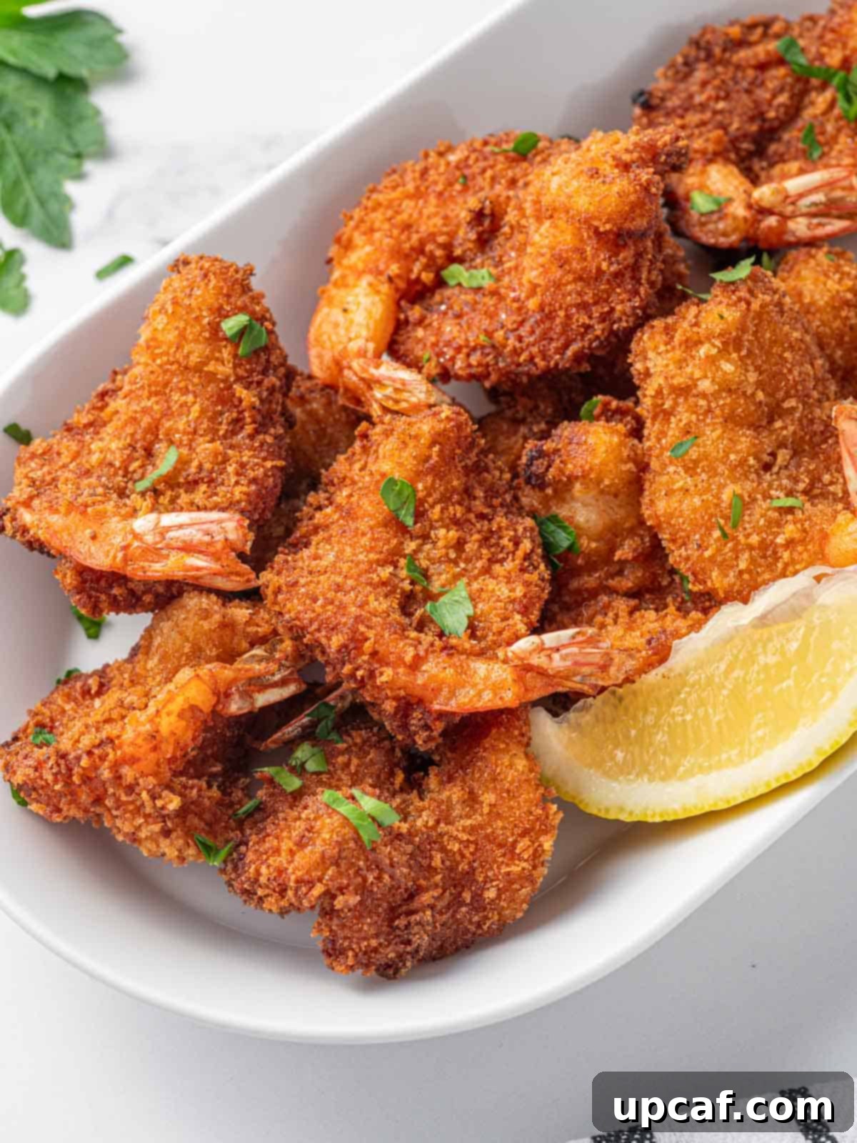 Closeup of fried butterfly shrimp.