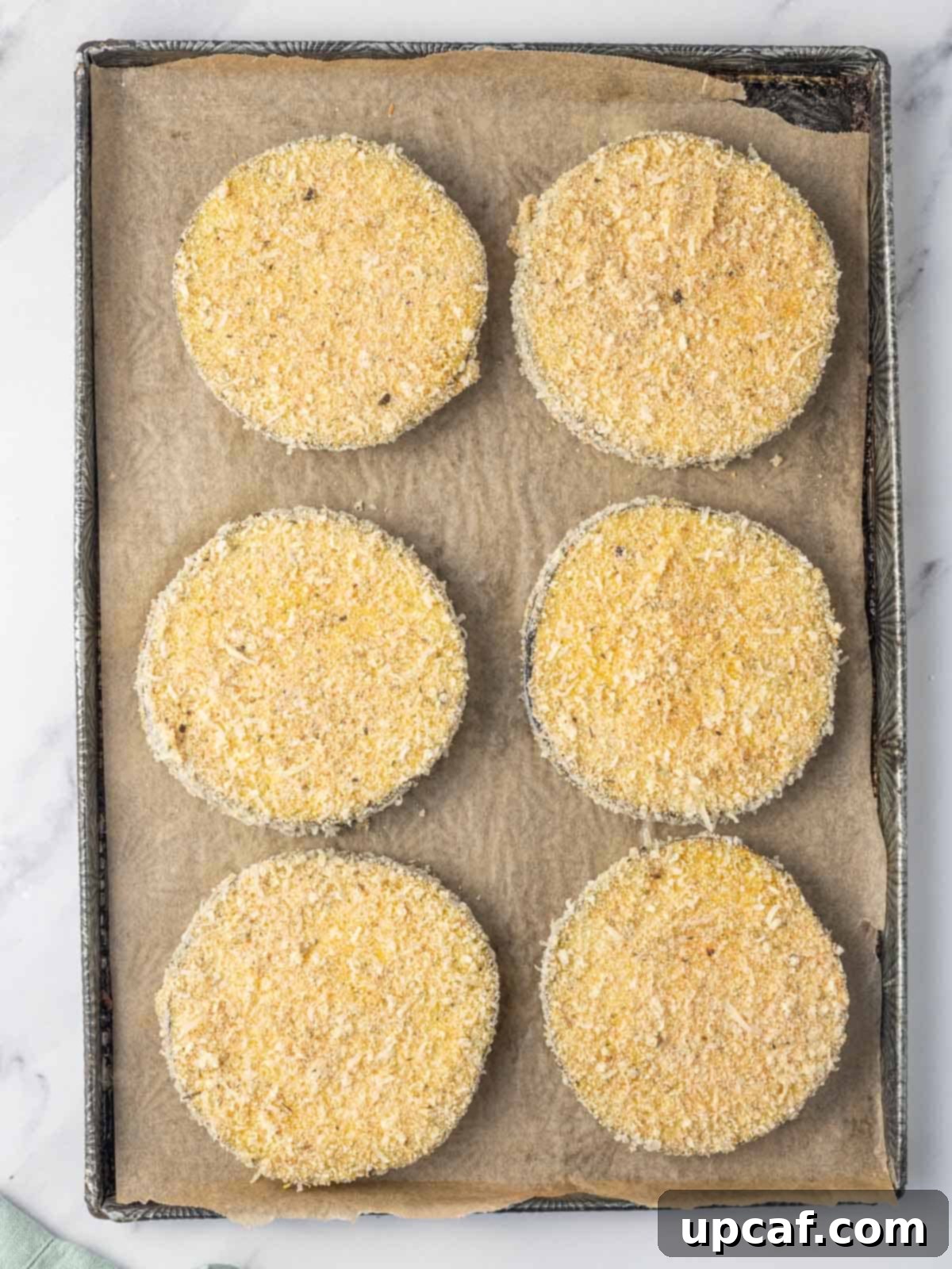 Breaded eggplant ready to be air fried.