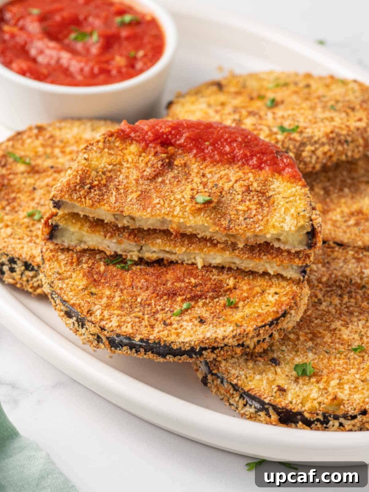 Eggplant dipped in marinara sauce.