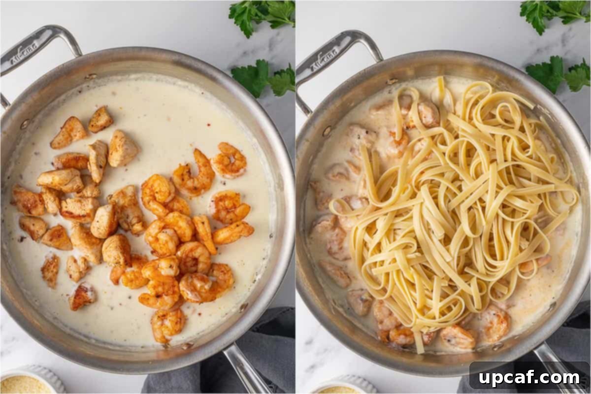 Combining cooked chicken, shrimp, and fettuccine pasta with alfredo sauce in a skillet.