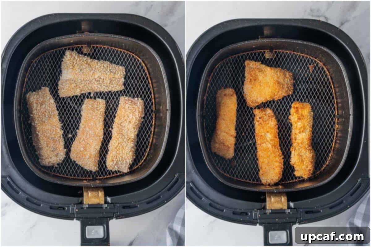 Guilt-Free Crispy Air Fryer Fish and Chips 5 Homemade crispy fish sticks arranged in a single layer in an air fryer basket.