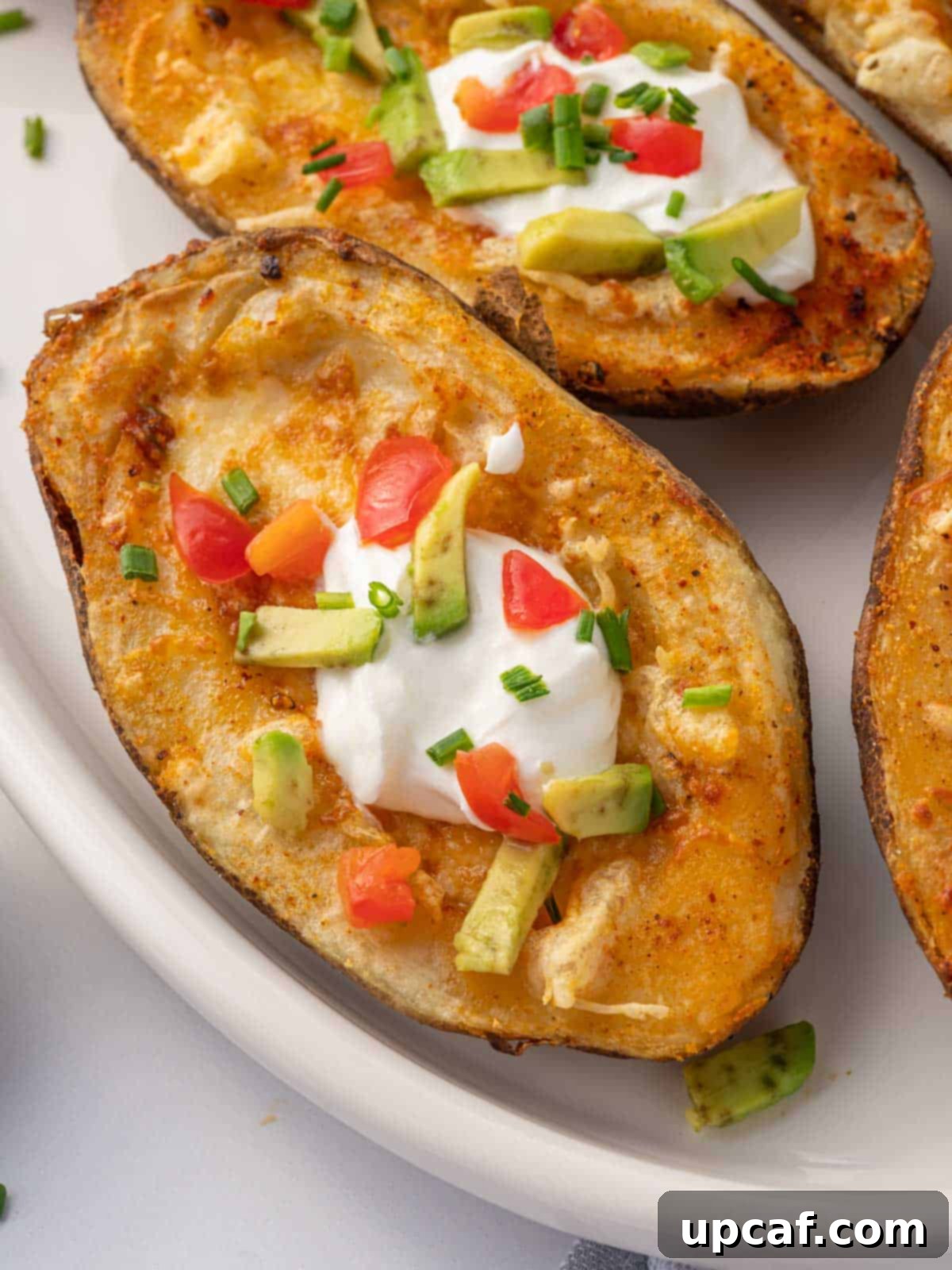 Crispy Air Fryer Potato Skins 8 Closeup of homemade potato skins on a plate.