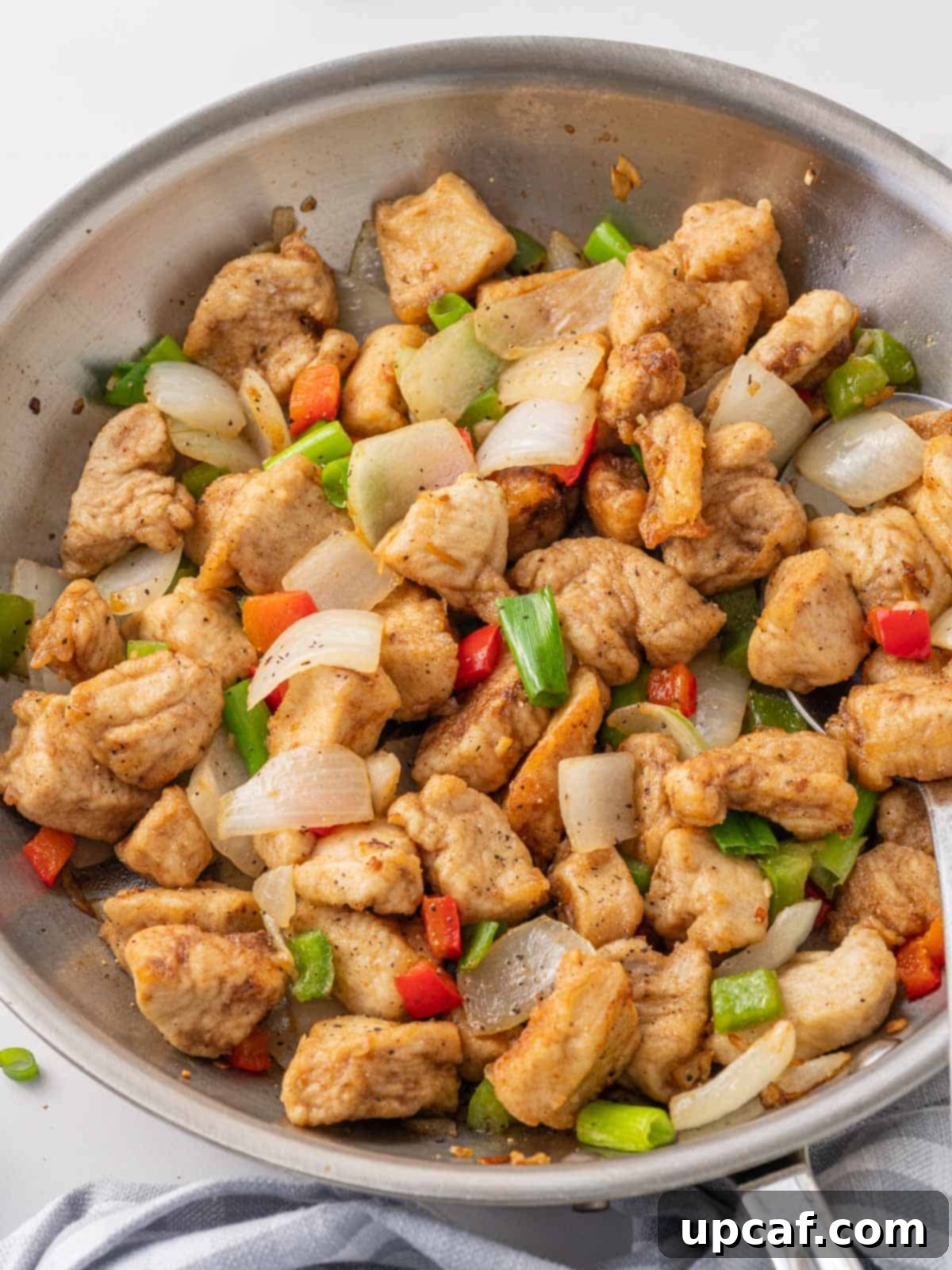 Crispy Salt and Pepper Chicken 8 Crispy salt and pepper chicken in a skillet.