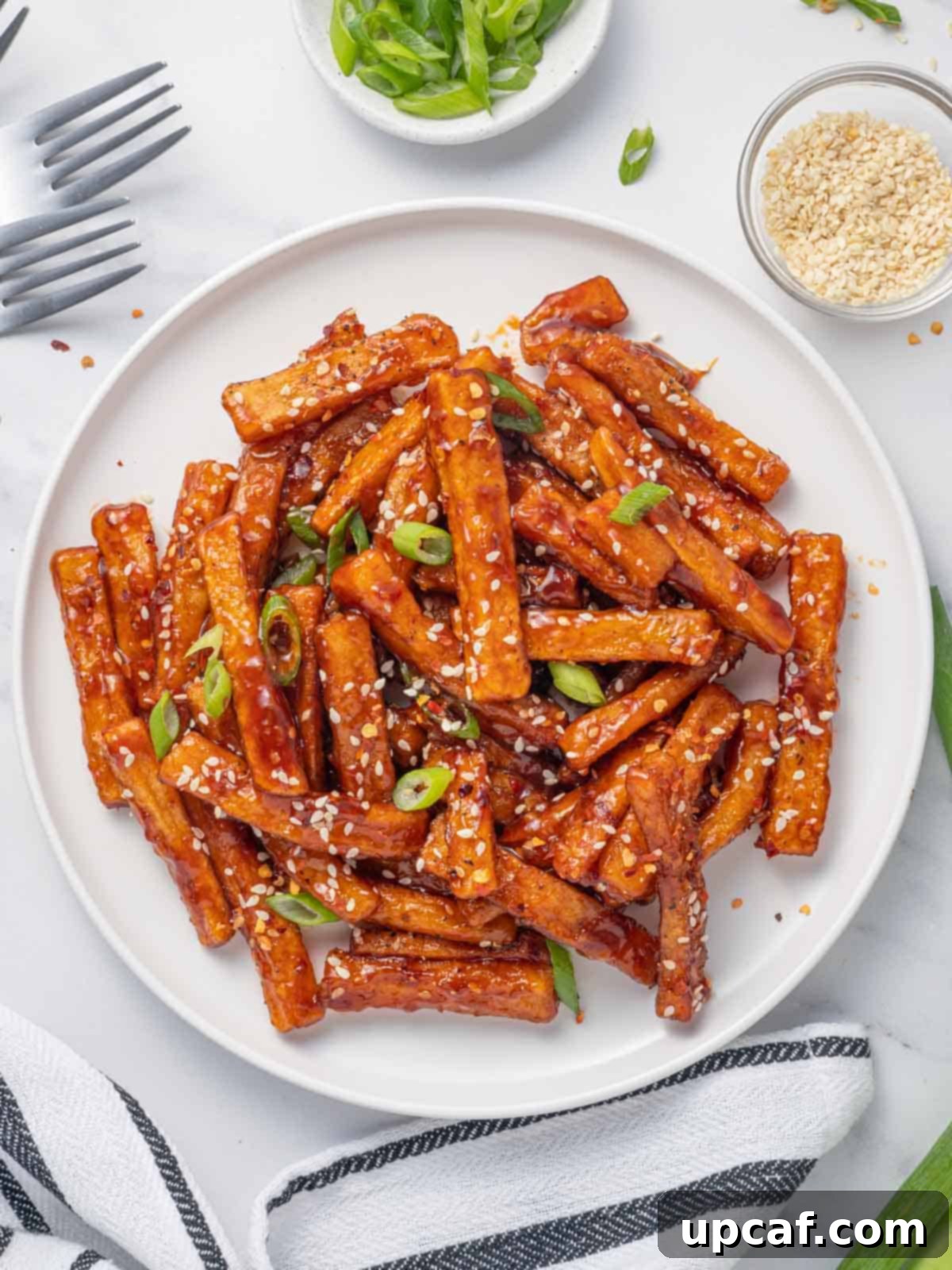 Spicy Honey Glazed Potatoes 2 A plate of honey red chilli fries.