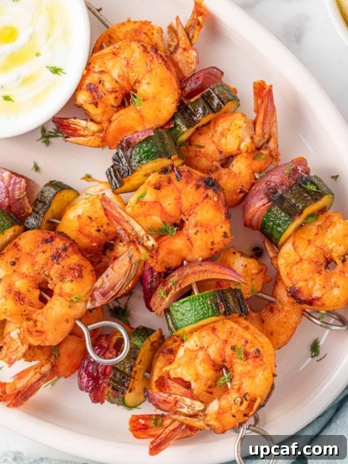 Golden Oven Shrimp Skewers 7 Closeup of perfectly grilled shrimp skewers with visible char marks and fresh seasoning.