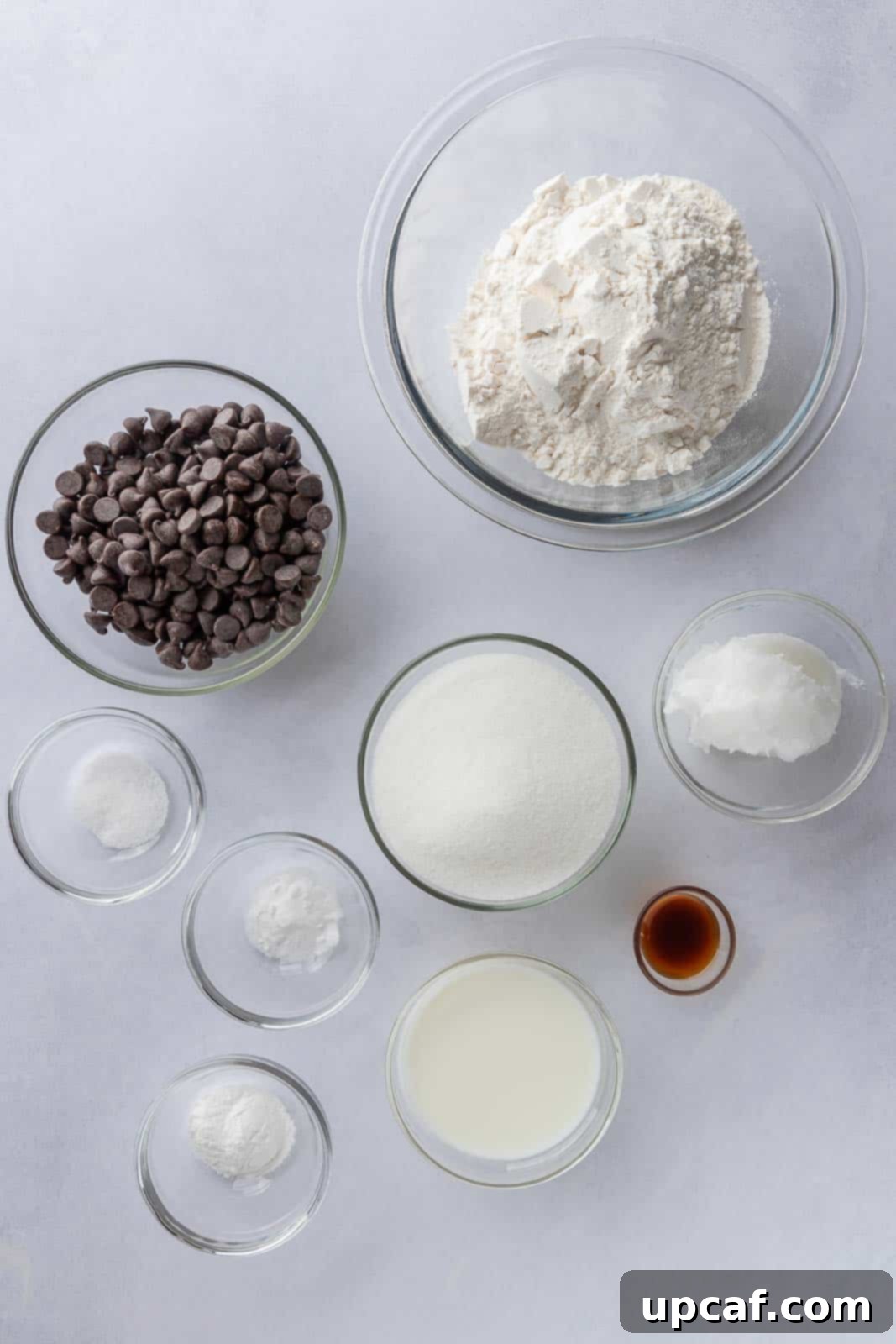 Ingredients needed to make eggless chocolate chip cookies, laid out on a clean surface.