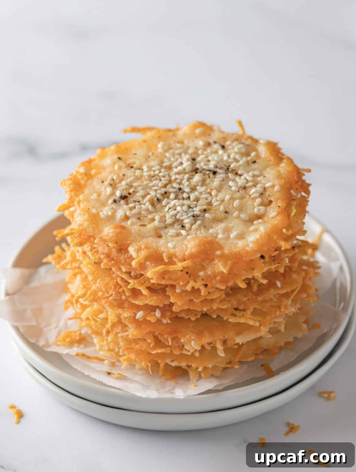 A pile of homemade parmesan keto crisps, golden brown and perfectly crispy, ready to be enjoyed as a low-carb snack.