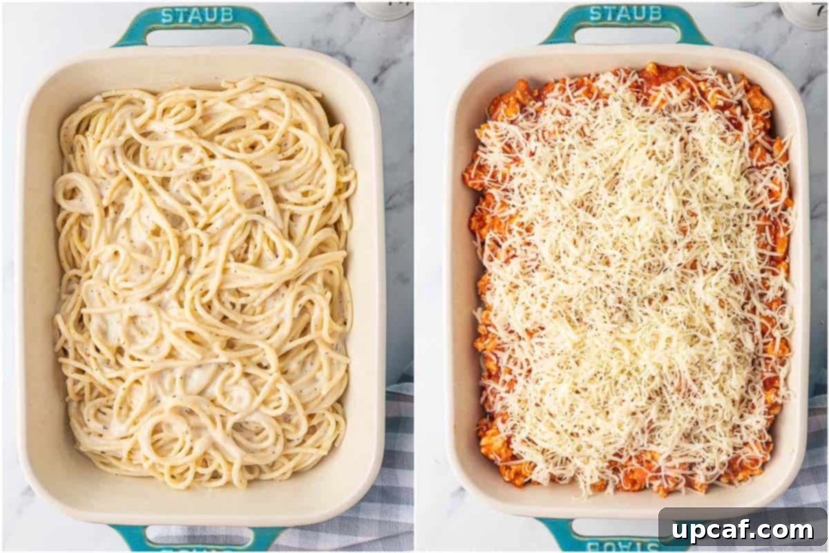 How to layer a TikTok Spaghetti casserole with Alfredo pasta, meat sauce, and mozzarella cheese.