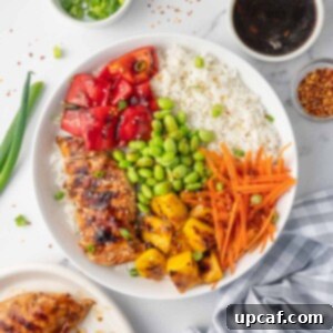 Sweet & Savory Teriyaki Chicken Bowl 9 A teriyaki chicken rice bowl with condiments on the side.