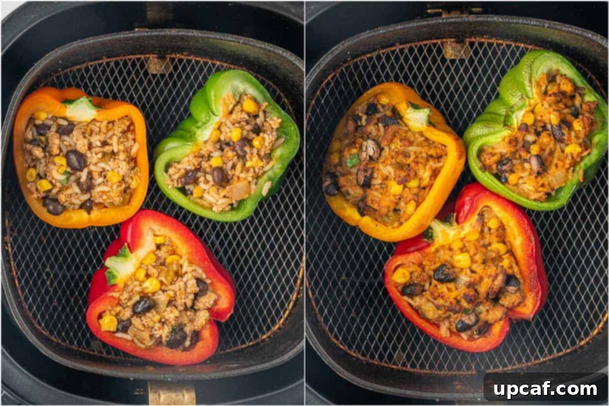 Golden-brown stuffed bell peppers cooking perfectly in an air fryer basket, showing the process of making air fryer stuffed peppers.
