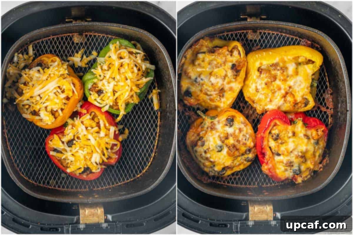 Perfectly melted Colby Jack cheese topping golden-brown taco stuffed peppers in the air fryer, signaling they are ready.