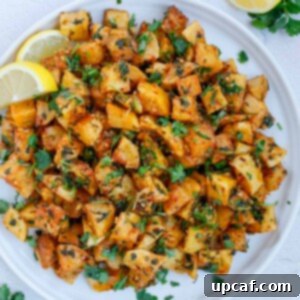 Batata Harra served on a white plate.