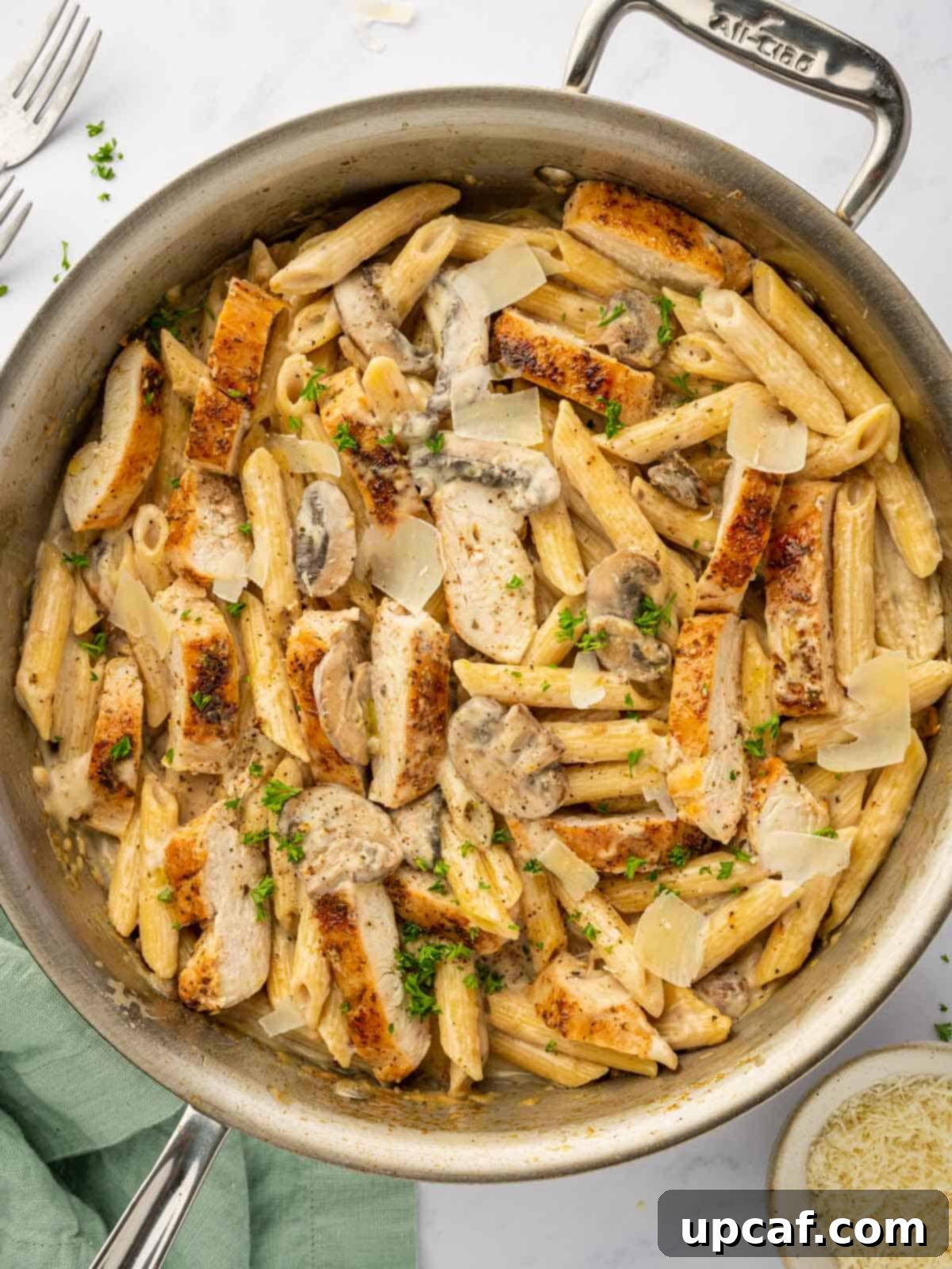 Creamy Garlic Parmesan Chicken Pasta 2 A skillet filled with creamy Garlic Parmesan Chicken pasta, ready to serve.