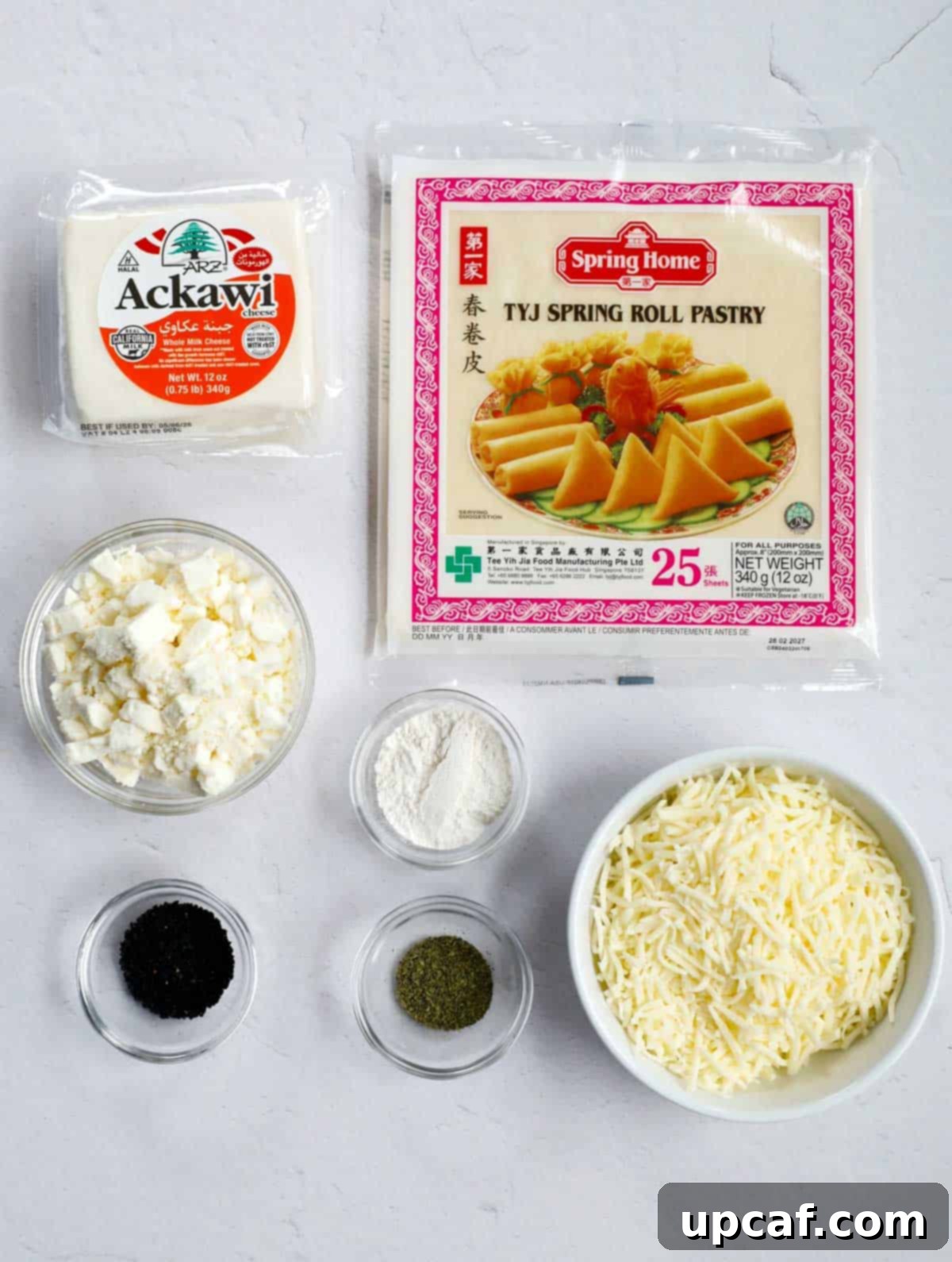 Ingredients for Lebanese Cheese Rolls laid out on a surface.