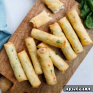 Fried Lebanese Cheese Rolls on a wooden board.